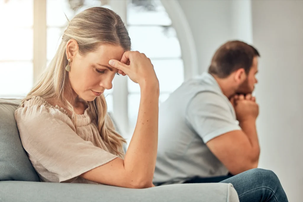 Infidelity, cheating spouse and drama on couch, relationship crisis and disagreement for betrayal