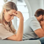 Infidelity, cheating spouse and drama on couch, relationship crisis and disagreement for betrayal